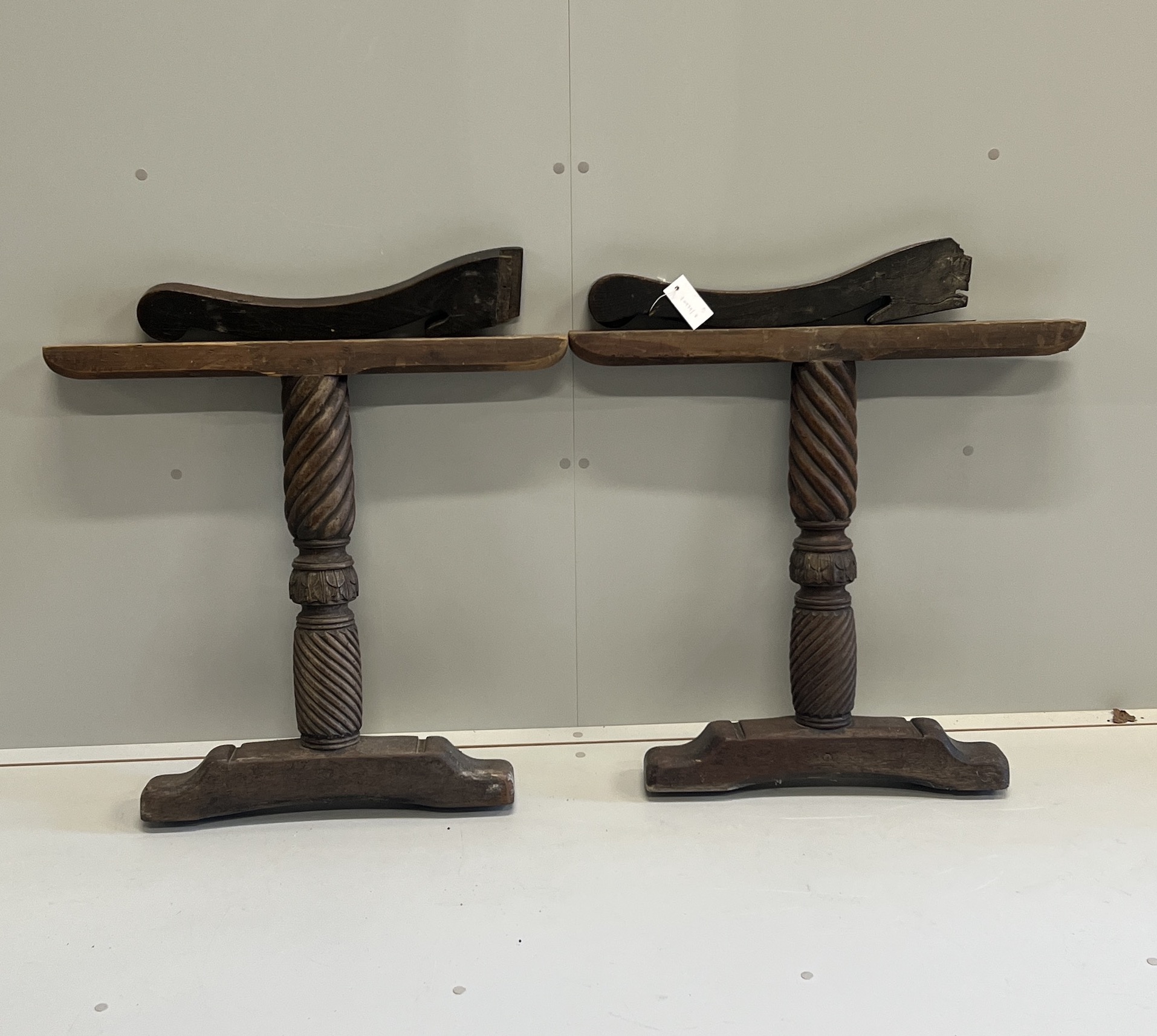 A pair of 17th century oak Wainscot chair arms together with a pair of turned walnut table supports